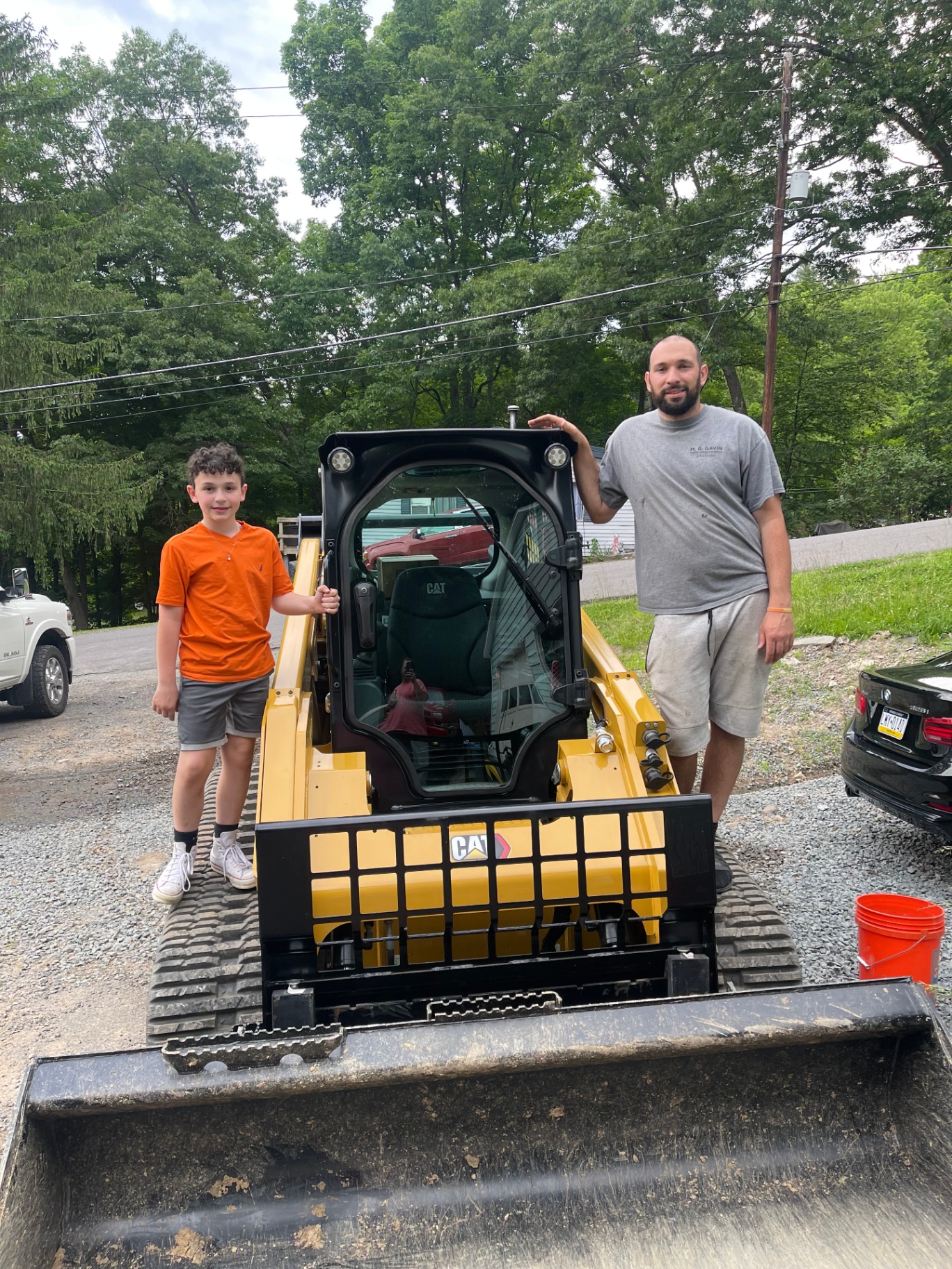 Gavin Construction & Excavating team with CAT skid steer